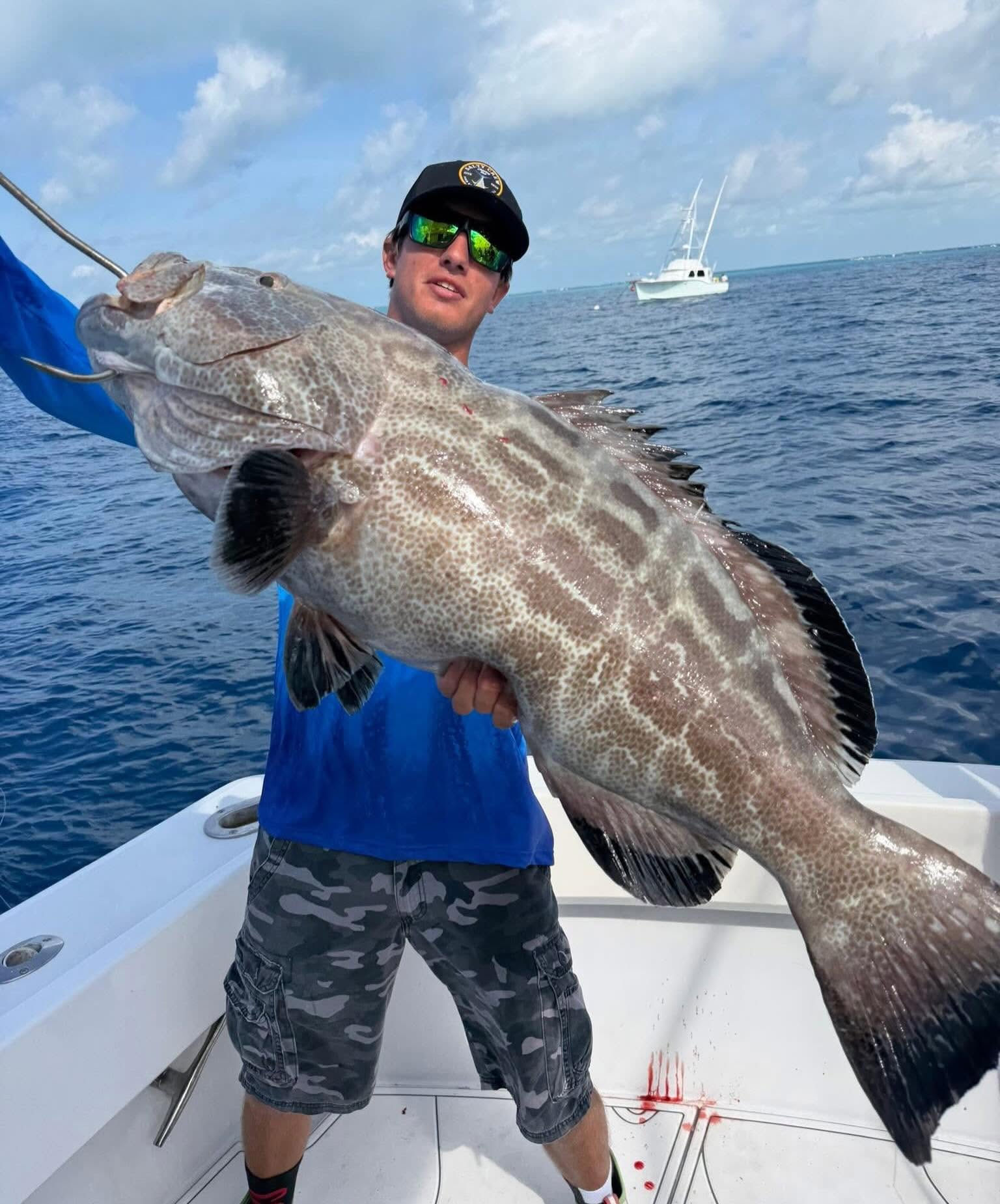 A heavyweight grouper pulled off deep structure with the Poppa Wahoo Collective