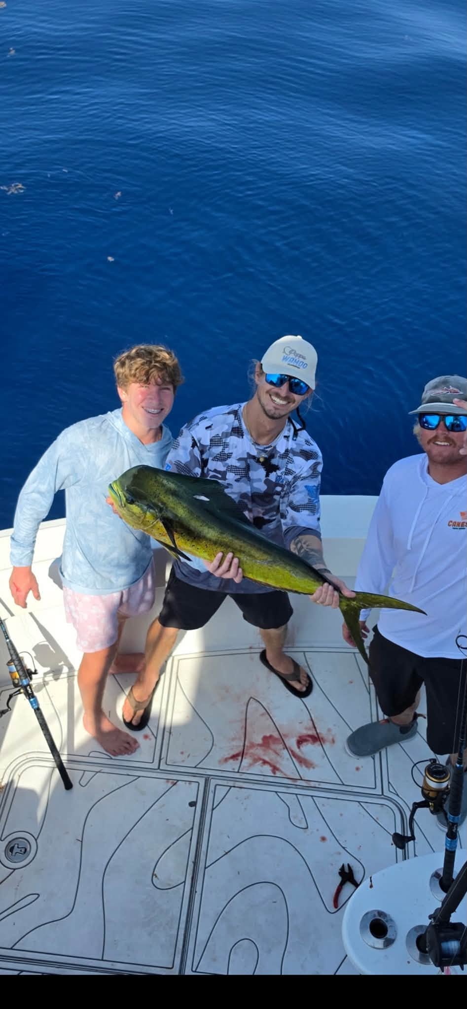 A bull mahi and a happy crew