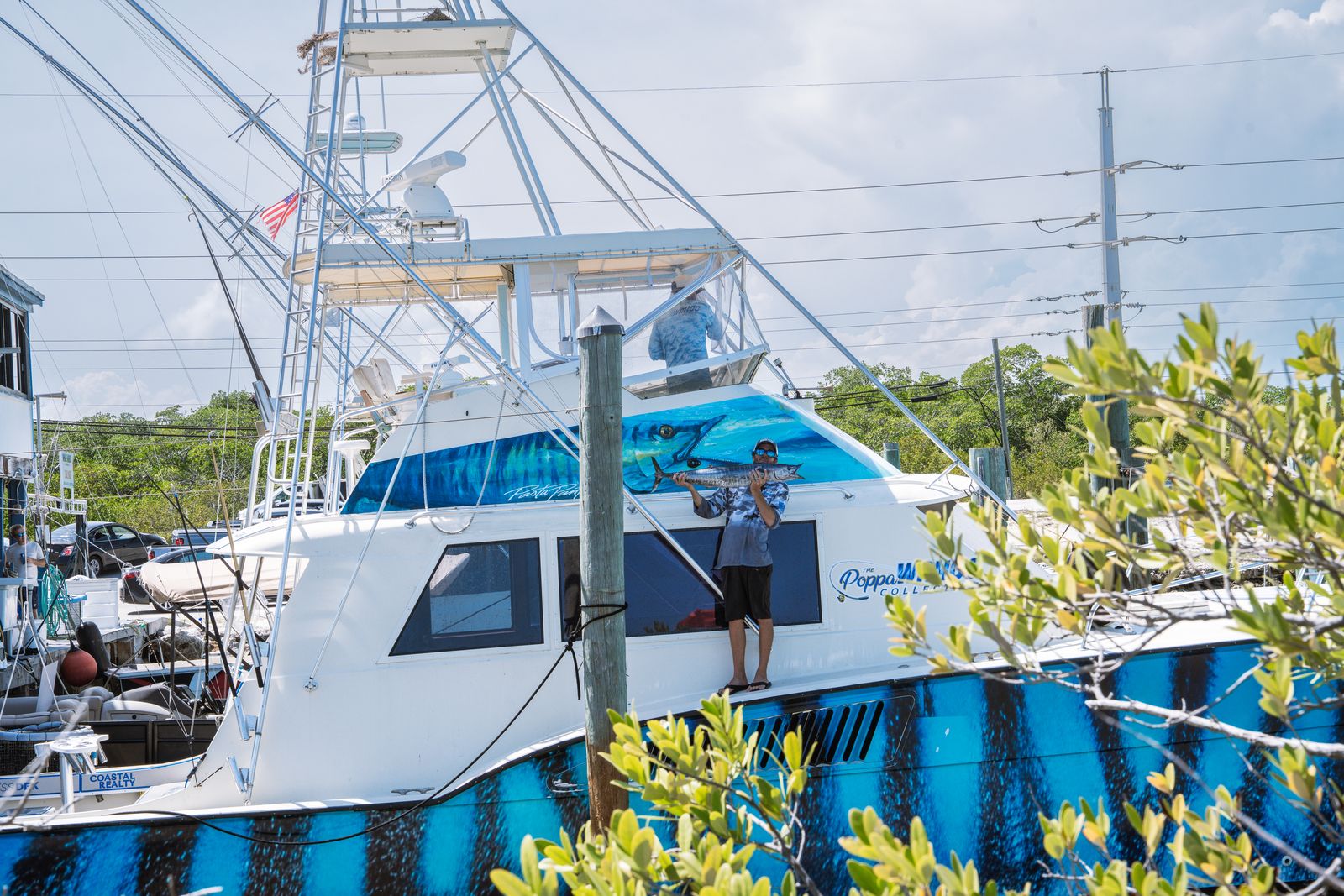 Poppa Wahoo, the 55 foot Hatteras, running off Islamorada with her transom script showing