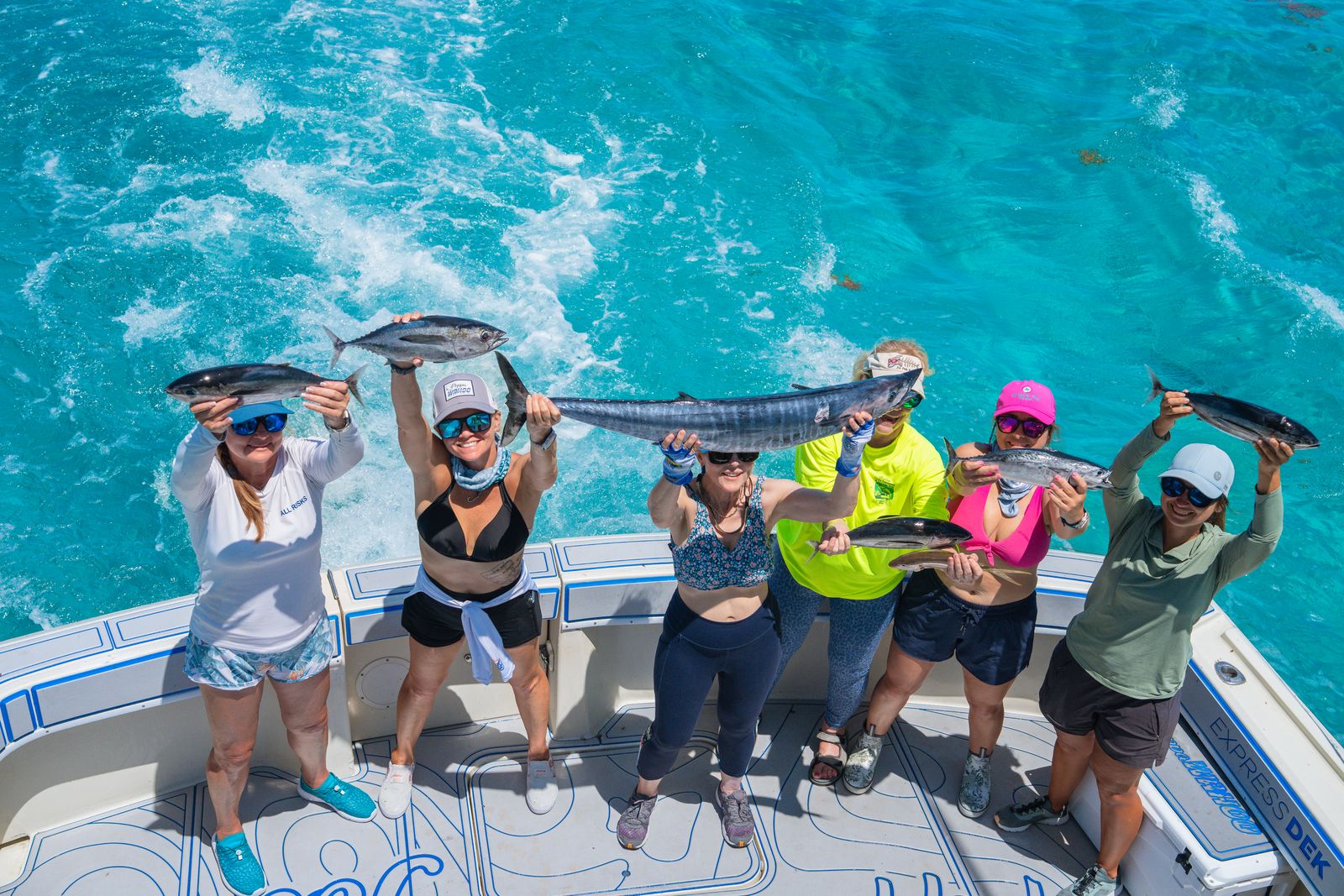 Group day: everyone holds a fish