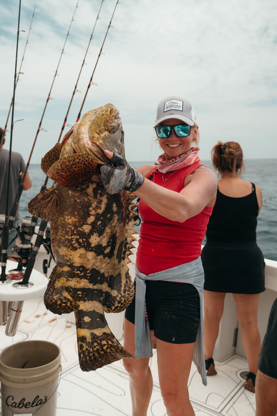 A huge grouper takes two hands