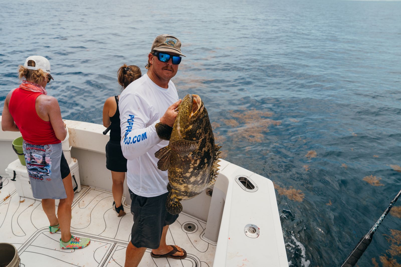 A heavyweight grouper pulled off deep structure with the Poppa Wahoo Collective