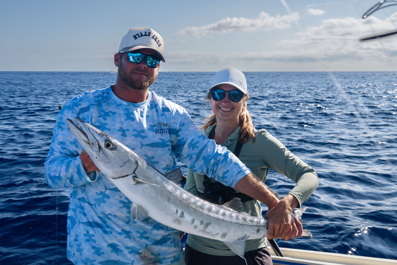 A king mackerel comes over the rail
