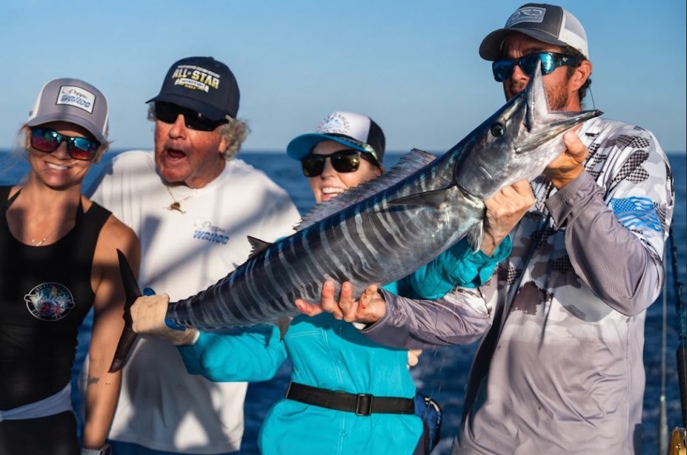 The crew with a wahoo taken along the Islamorada and Marathon reef line