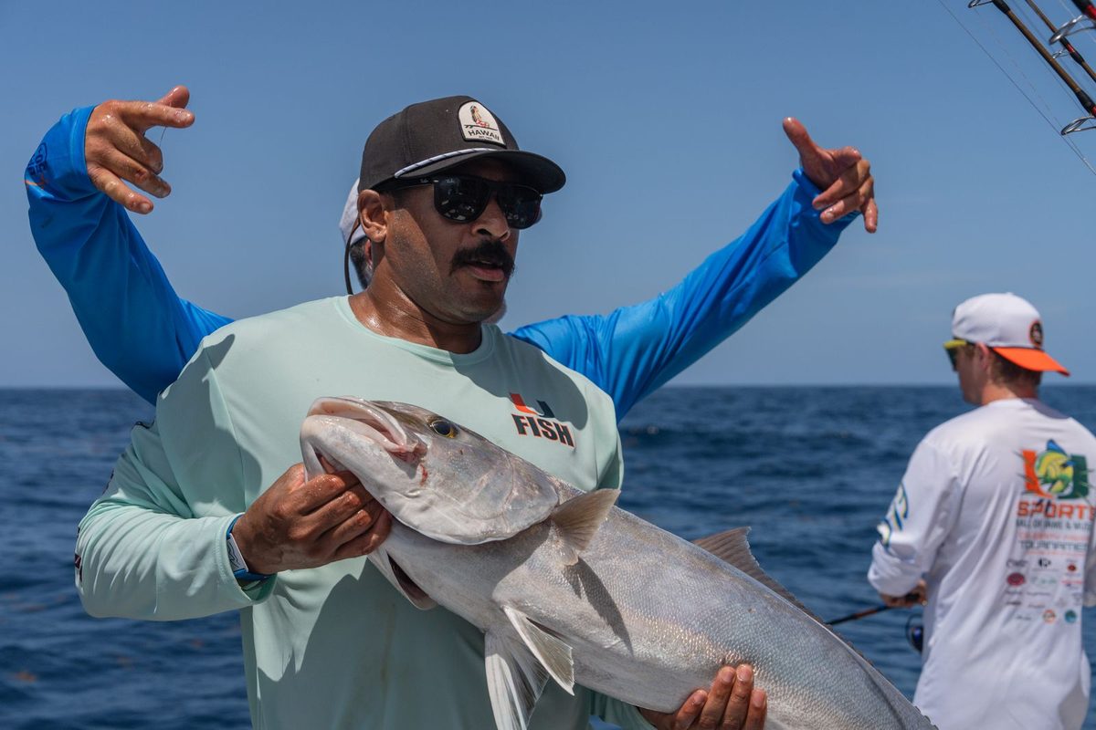 An angler holding an amberjack off Islamorada