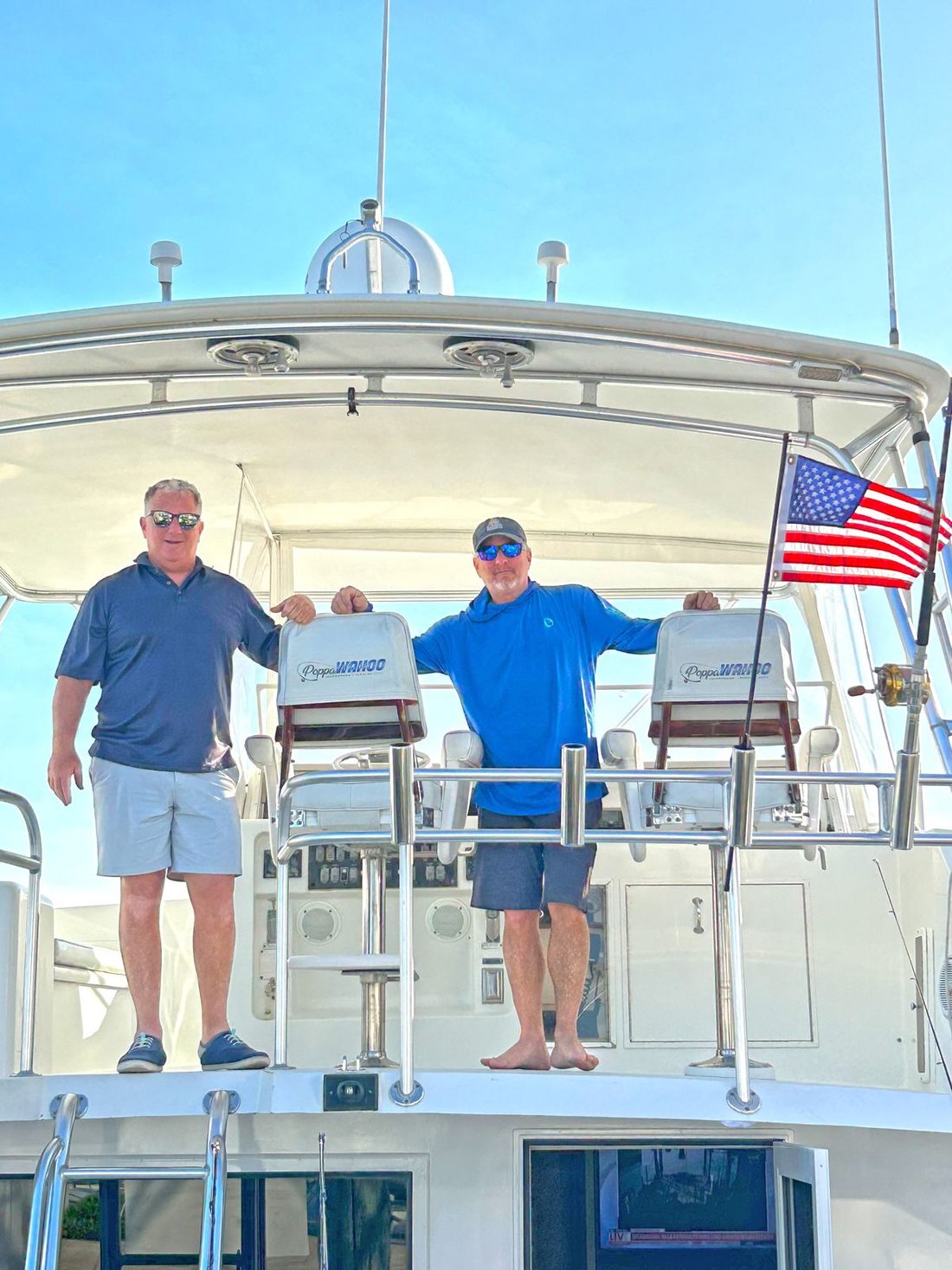 Brian and David Epstein on the tower of a collective boat