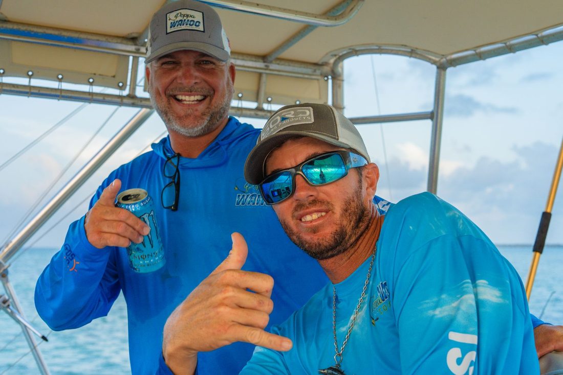 Two Poppa Wahoo Collective captains under the hardtop off Islamorada