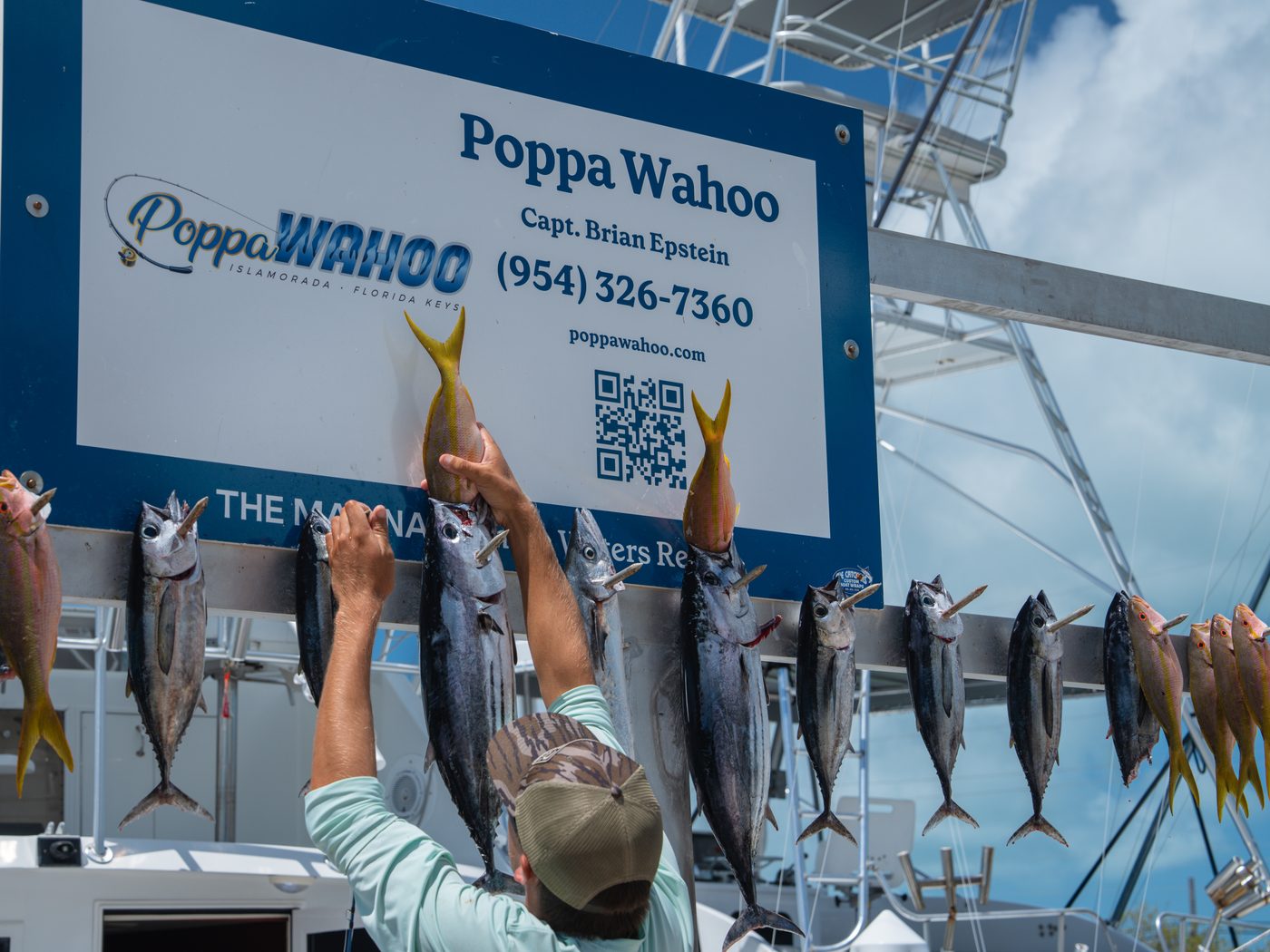 The day's catch hanging on the Poppa Wahoo board at Three Waters Resort Marina