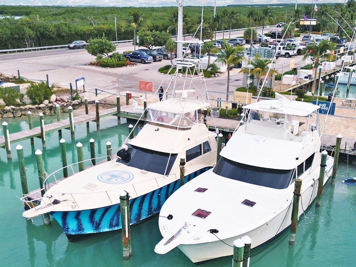 Both Hatteras sportfishers tied up side by side