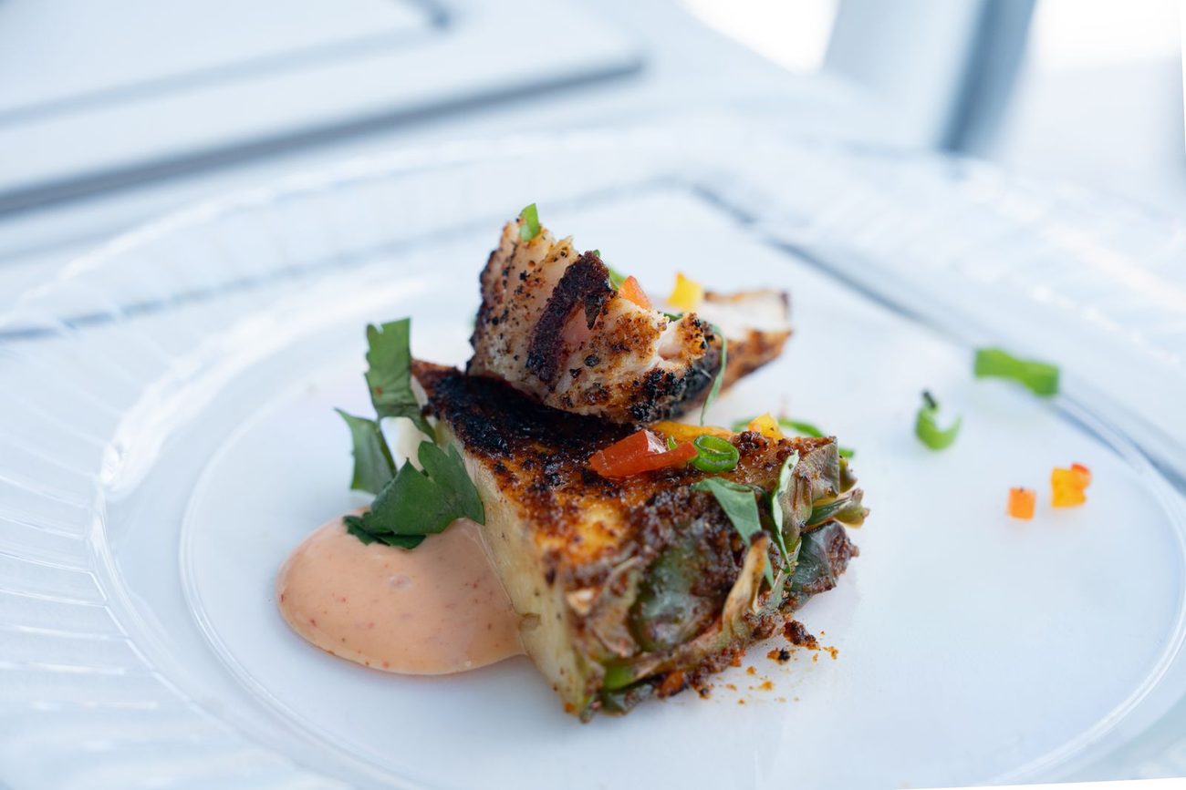 A plated course served on board during a chef-catered cruise