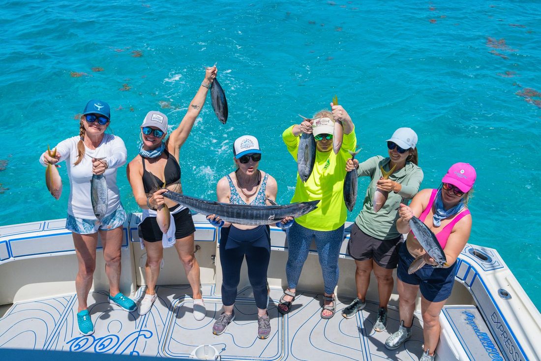 A full charter group with their catch on the back deck
