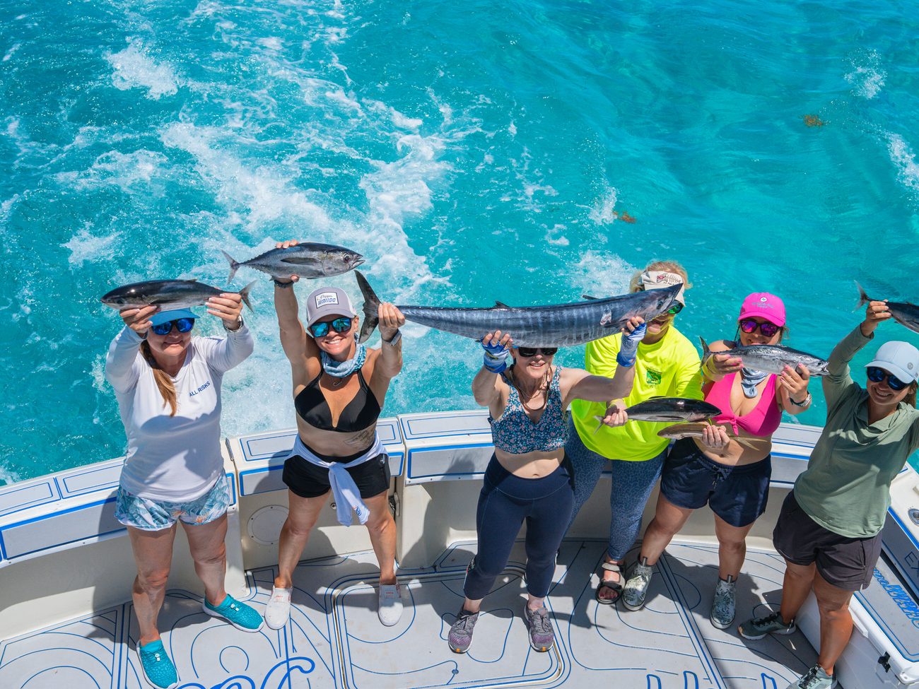 A group on the transom holding the day's catch off Islamorada