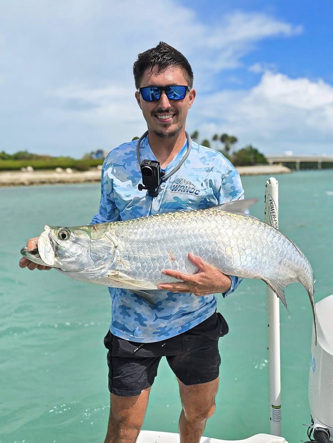 A tarpon cradled boatside in the backcountry